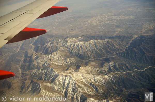 Aitline wing overlooking the snowcapped mountains of Southern California